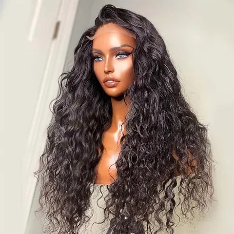 The model is showcasing Ntsika Long, which is a long, Water Wave Cambodian wig, with a choice between a 13x4 ear to ear frontal lace or 6x4 closure.  It features an undetectable HD Lace or transparent Swiss lace. The wig is part of our Premium Collection of 100% raw virgin human hair with cuticles intact and aligned. It is a glue-less, wear and go wig with adjustable and detachable bands. It comes standard with a pre-plucked hairline and bleached knots. Comes in 22”.
